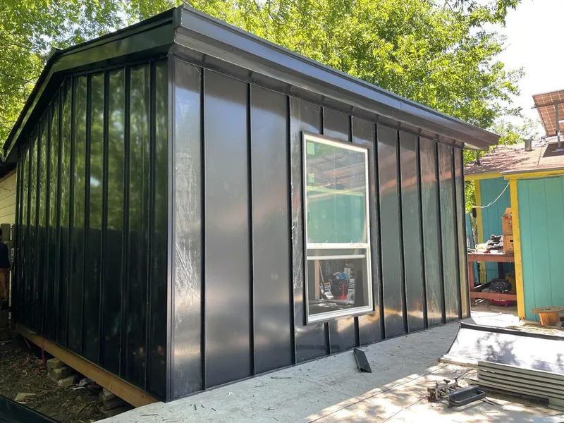 Black standing seam metal wall panels for Roof Inspection in Edmonds