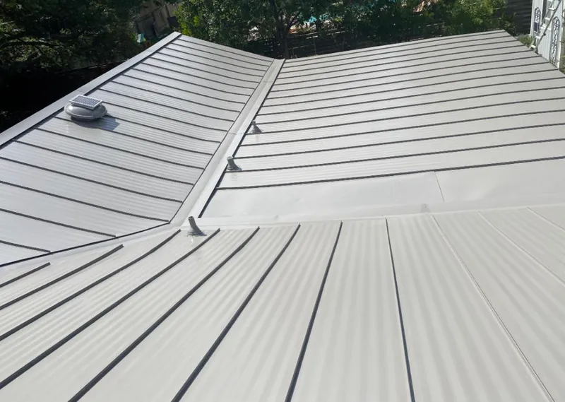 Solar attic fan installed on a metal roof for Roof Ventilation in Edmonds